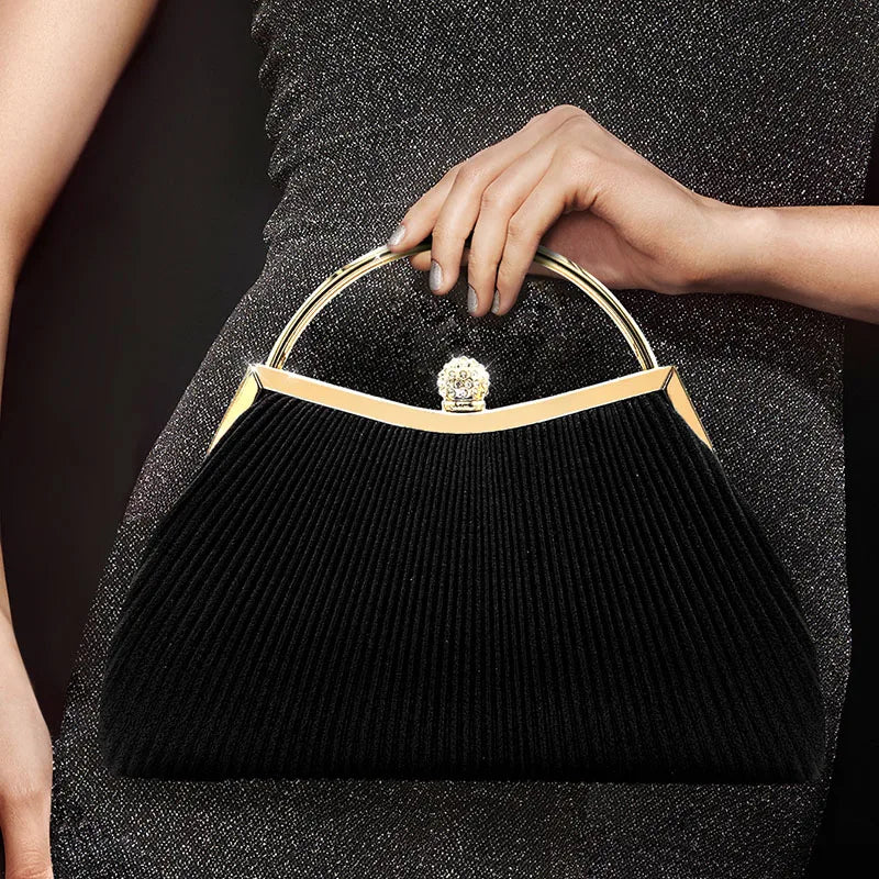 Gold MC THE BLACK DIAMOND pleated evening clutch bag with top handle, diamond accents, perfect for weddings and parties.