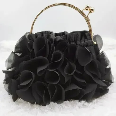 Luxury satin floral bride clutch bag by MC THE BLACK DIAMOND, featuring a small shoulder chain and elegant floral design.