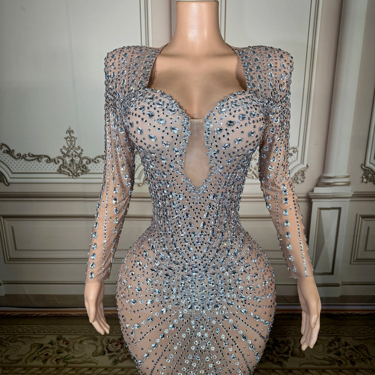 Elegant long black dress by MC THE BLACK DIAMOND, featuring a flowing silhouette and sophisticated design.