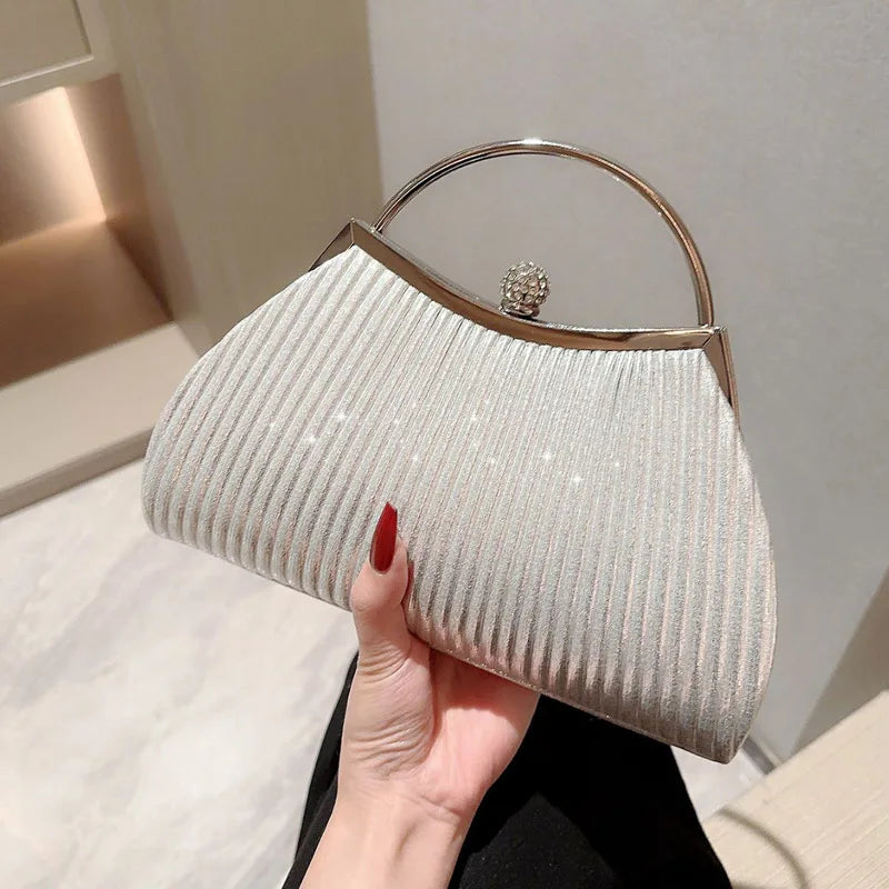 Gold MC THE BLACK DIAMOND pleated evening clutch handbag with glitter, top handle, diamond accents, perfect for weddings and parties.
