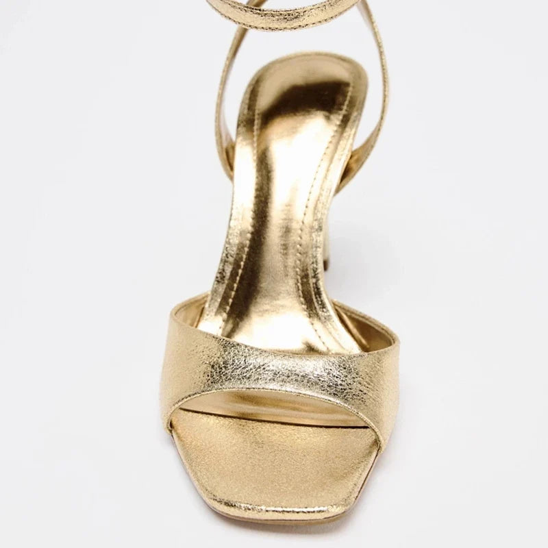 Gold patent leather ankle buckle high heel sandals for women by MC THE BLACK DIAMOND, featuring stylish design and ankle strap.