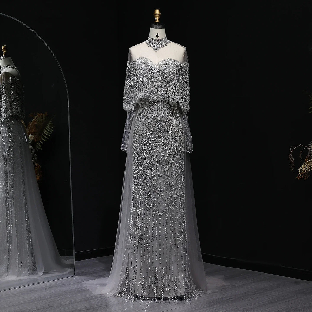 Beaded grey Arabic evening dress by MC THE BLACK DIAMOND featuring intricate beadwork and elegant design for formal occasions.