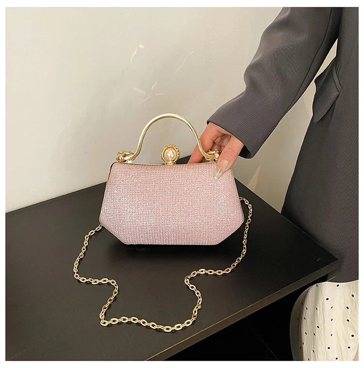 Black solid color MC The Black Diamonds women’s hand bag with chain strap and simple crossbody style, featuring hasp closure.