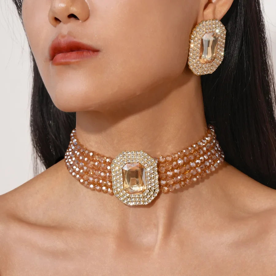 FYUAN jewelry set with multicolayer champagne, red, white, black crystal necklace and geometric square earrings by MC THE BLACK DIAMOND.