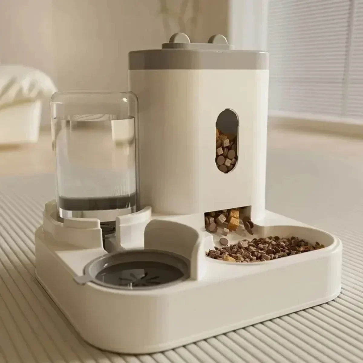 Automatic pet food and water bowl by MC THE BLACK DIAMOND with built-in fountain for easy feeding and hydration.