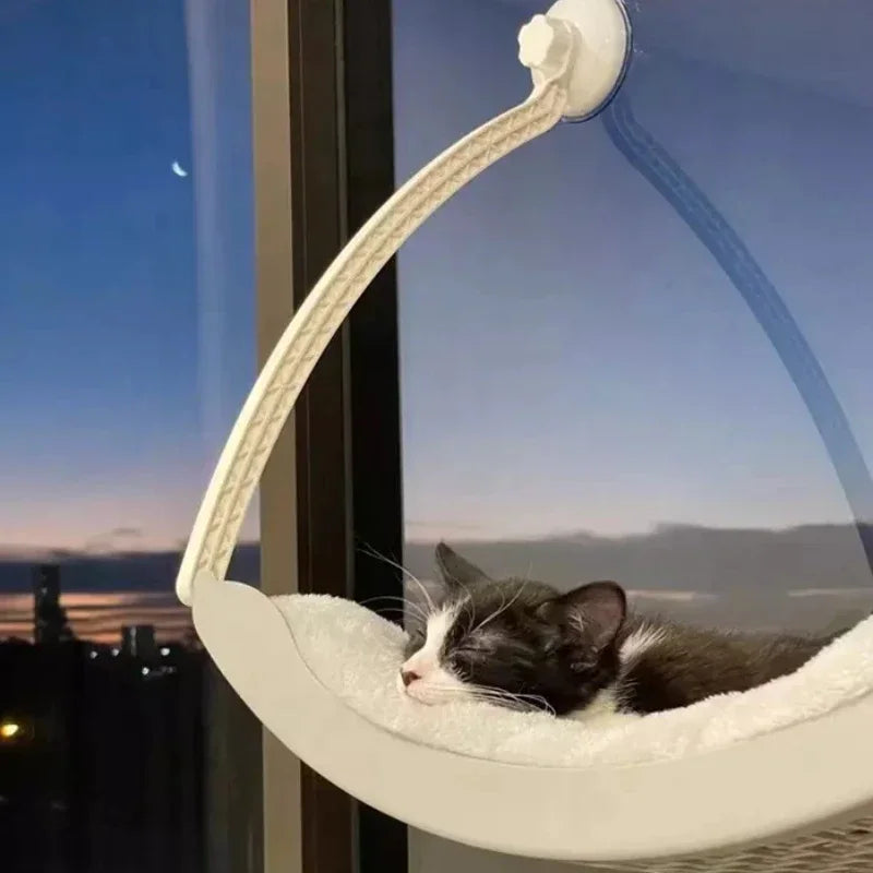 Comfortable MC THE BLACK DIAMOND cat hammock bed with Arctic fleece cushion and suction cups for balcony window sunbathing.