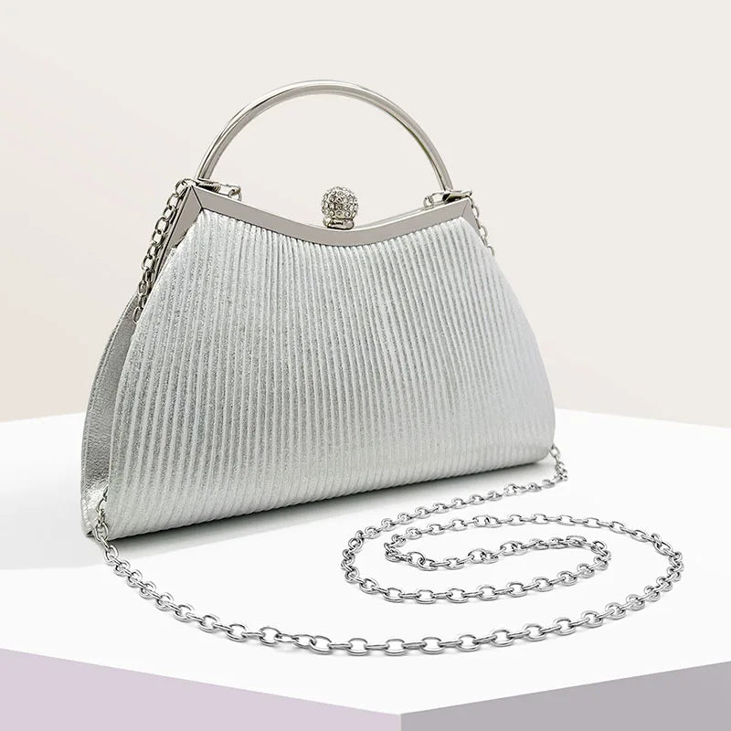 Gold MC THE BLACK DIAMOND pleated evening handbag with top handle, glitter finish, diamond accents, perfect for weddings and parties.