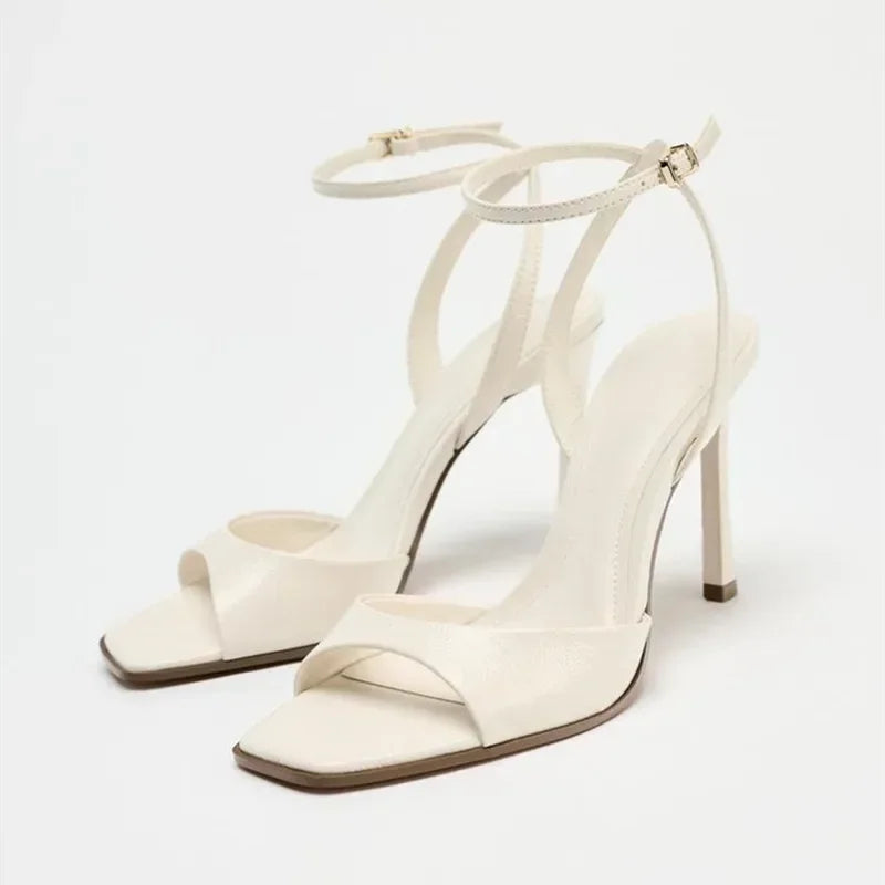 Gold patent leather ankle buckle high heel sandals for women by MC THE BLACK DIAMOND, showcasing stylish heel and ankle strap details.