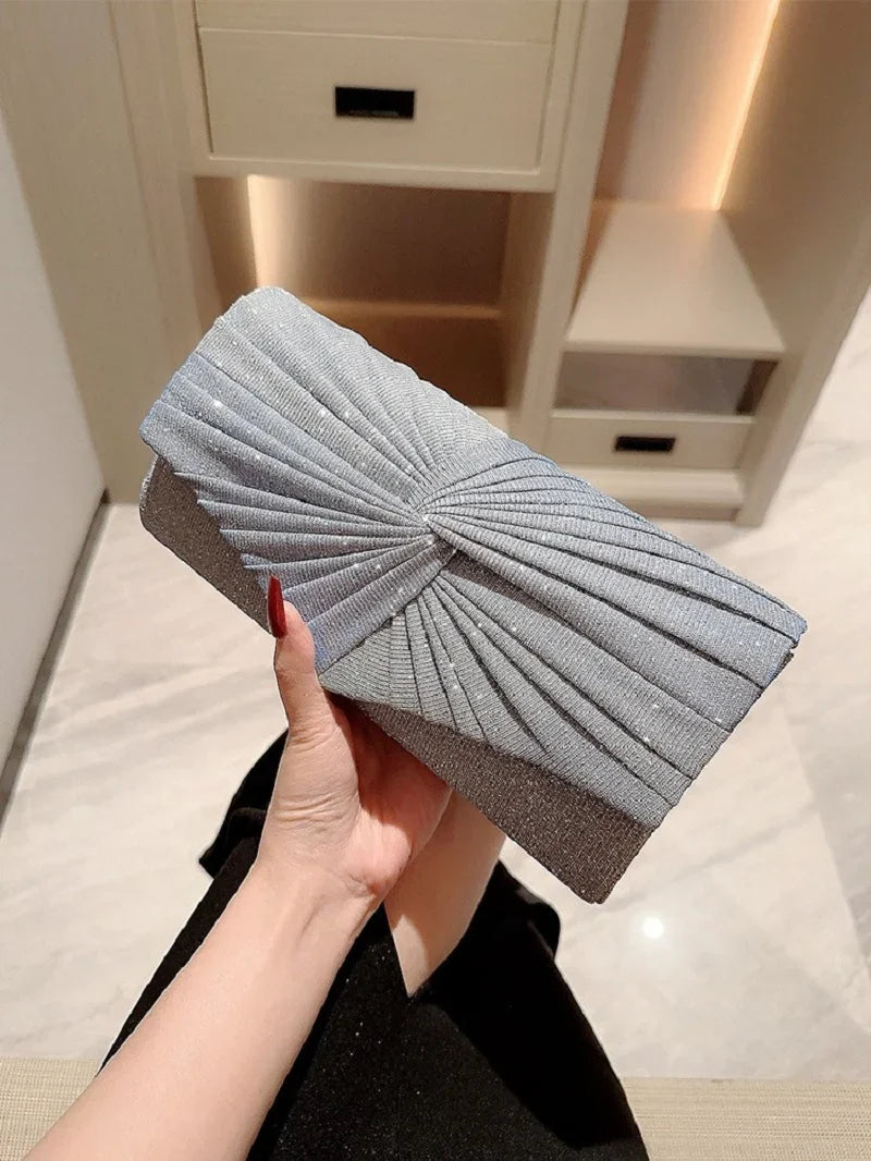 Elegant silver ladies evening clutch bag from Mohammad Collection, featuring a shining design, crossbody strap, and stylish wallet layout.