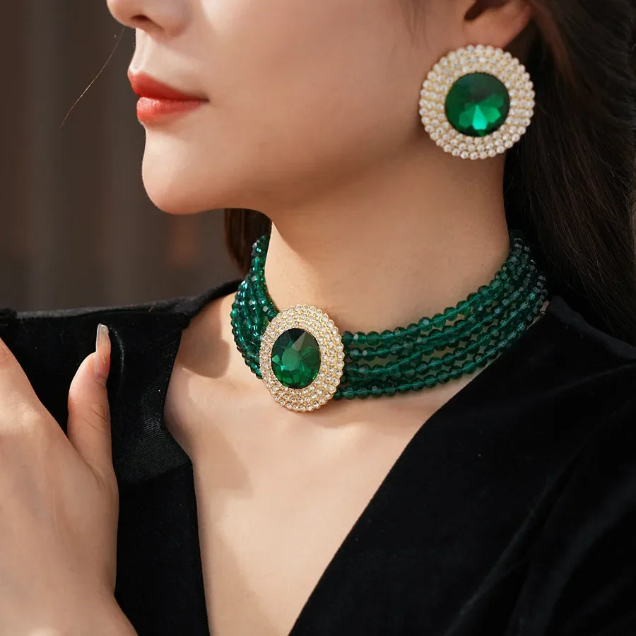 Green rhinestone jewelry set including necklace and earrings with glass round stones, elegant and luxurious for women.