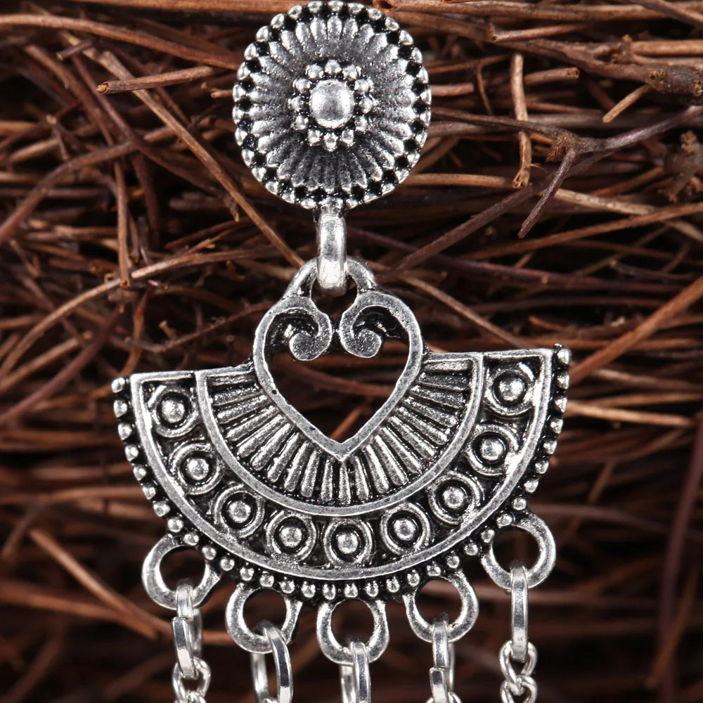 Silver Egyptian geometric bell earrings with long tassels and jhumka design, featuring ethnic Turkish and Afghan jewelry style.