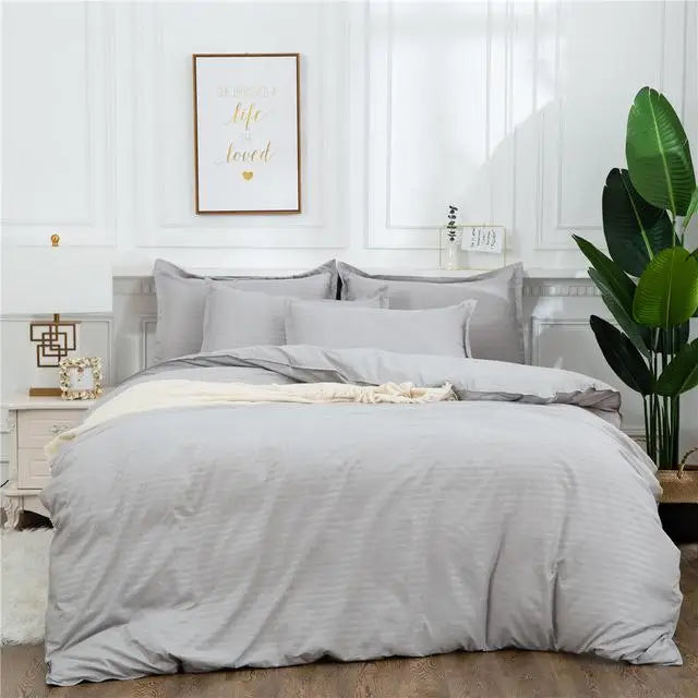 Black quilt set by MC THE BLACK DIAMOND, double to king size bedding with solid color duvet cover and high-quality bedsheets.