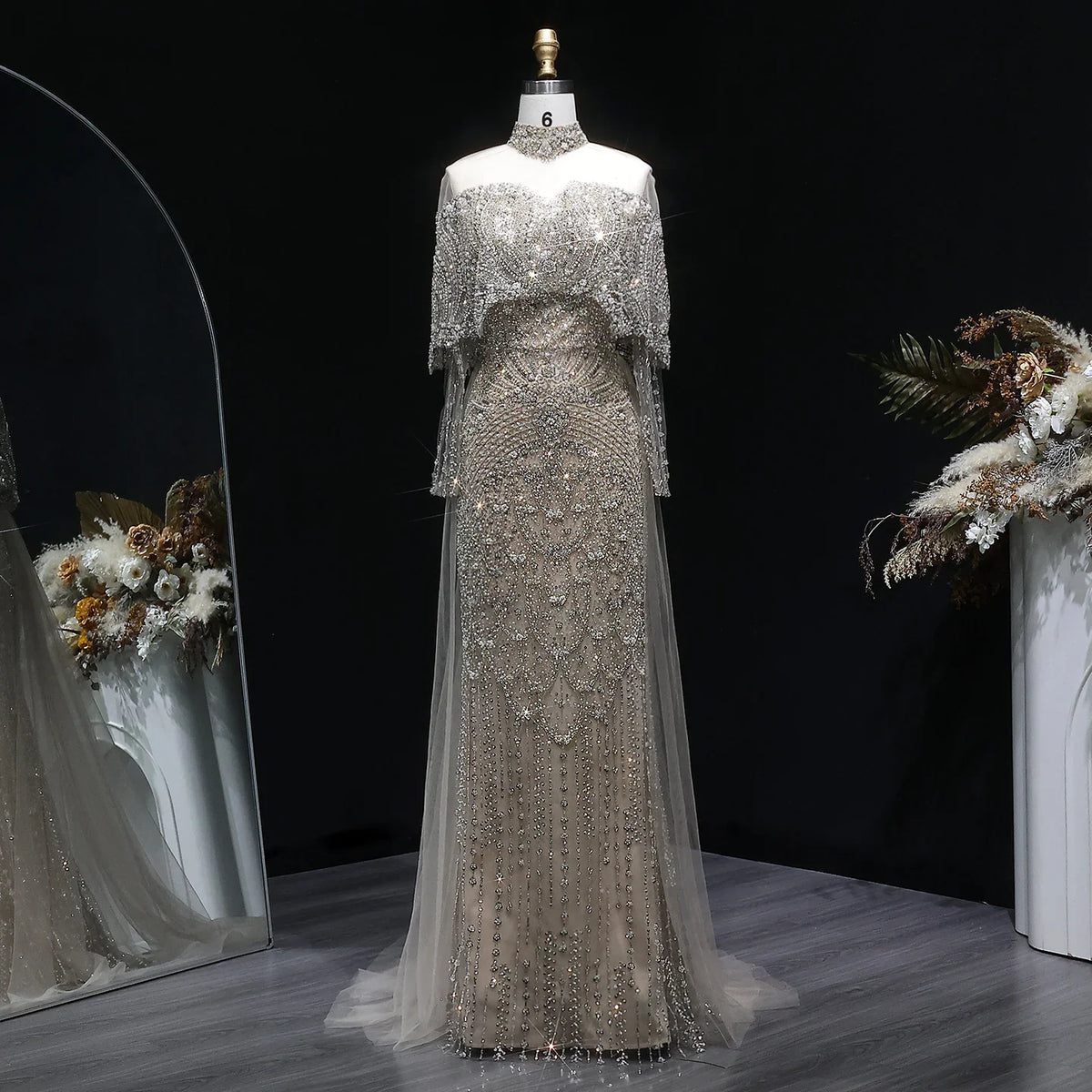Beaded grey Arabic evening dress by MC THE BLACK DIAMOND featuring intricate beadwork and elegant design for formal occasions.
