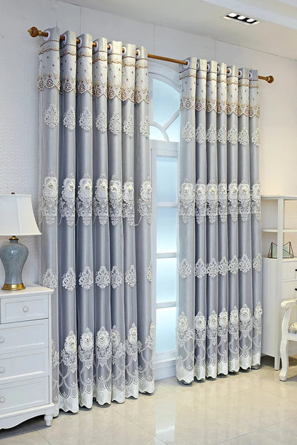Elegant black blackout curtains with embossed base and 3D embroidery, perfect for bedroom or living room decor.