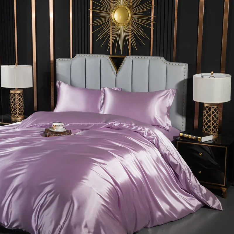 Luxury silk bedding set with duvet cover, fitted sheet, flat sheet, and pillowcases in king, queen, double, and twin sizes.