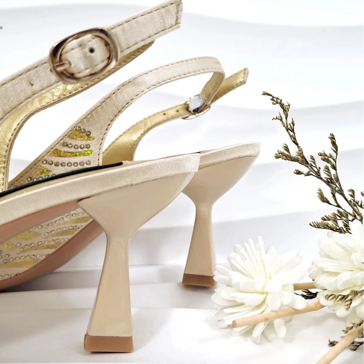 Nigerian style women heels and shiny clutch bags by MC THE BLACK DIAMOND, featuring pointed toe stiletto heels and elegant accessories.