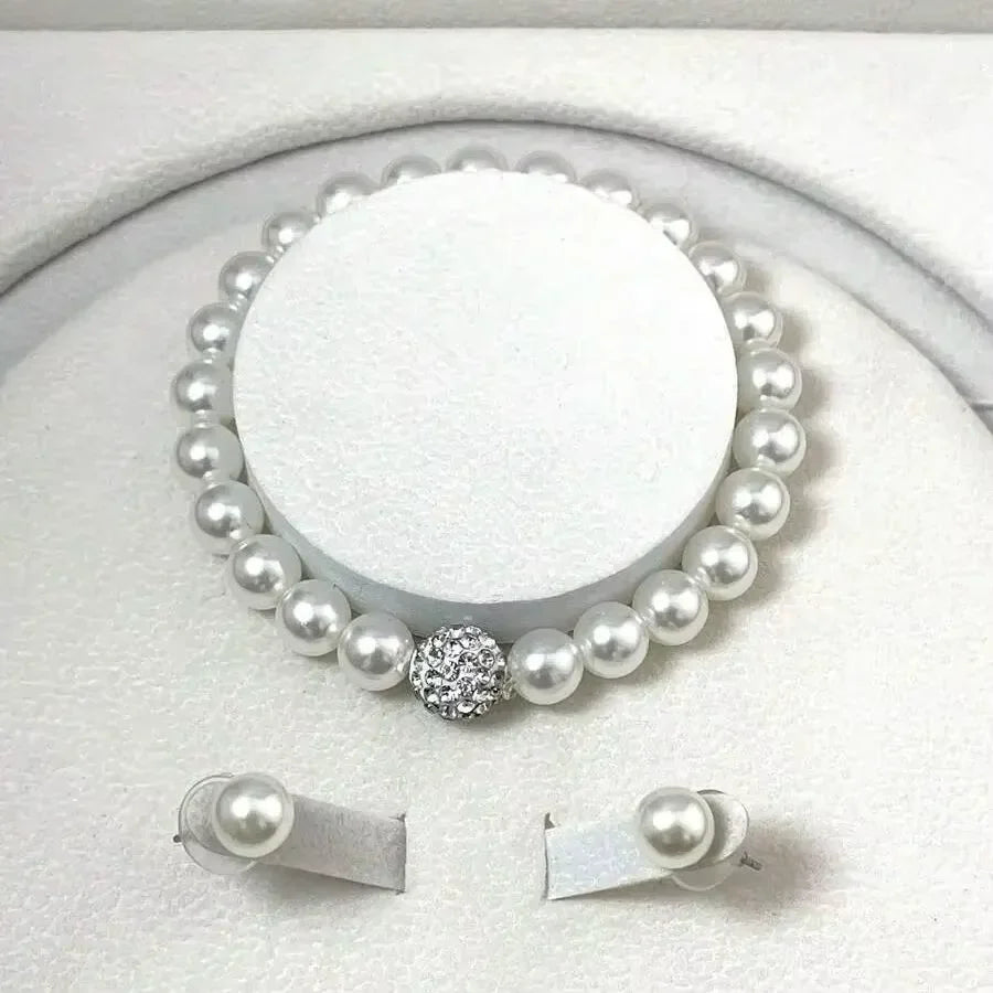 Gold jewelry set with necklace, bracelet, and stud earrings featuring black diamonds from 𝕄𝕔 𝕋𝕙𝕖 𝔹𝕝𝕒𝕔𝕜 𝔻𝕚𝕒�