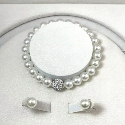 Gold jewelry set with necklace, bracelet, and stud earrings featuring black diamonds from 𝕄𝕔 𝕋𝕙𝕖 𝔹𝕝𝕒𝕔𝕜 𝔻𝕚𝕒�