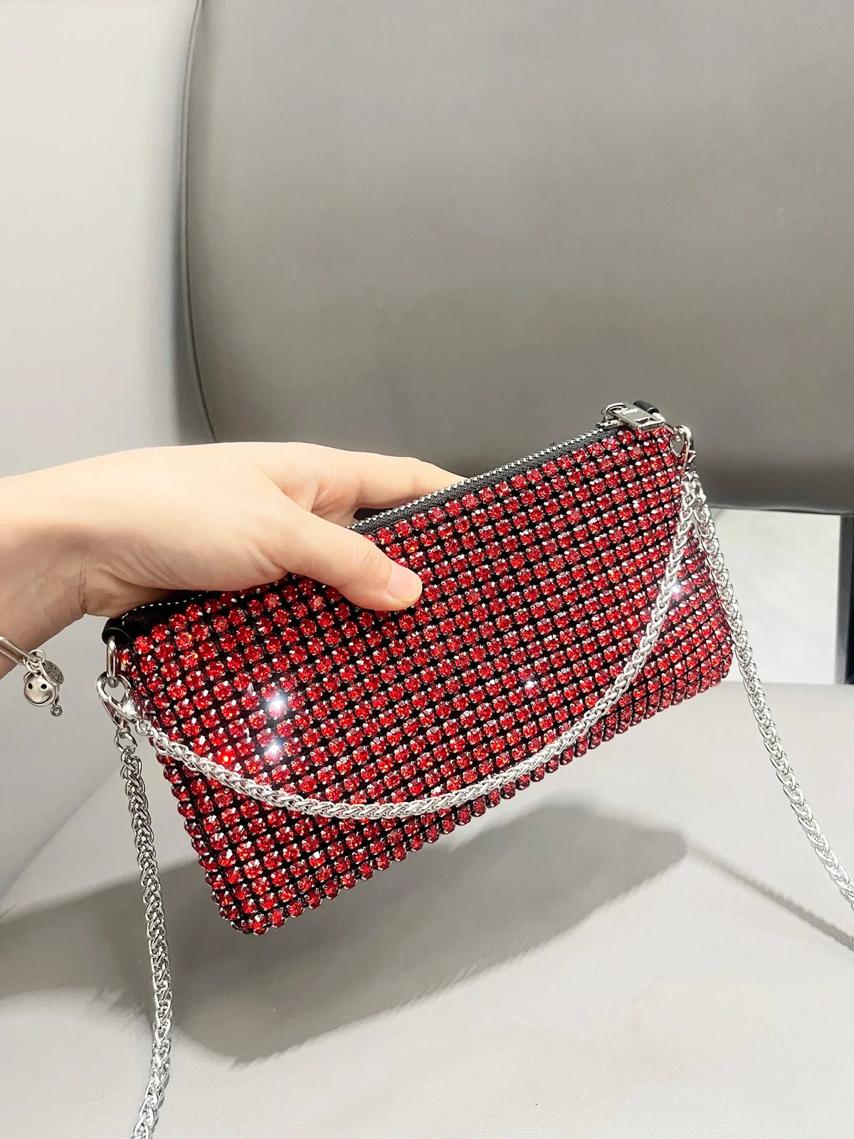 Luxury MC THE BLACK DIAMOND rhinestones clutch purse for women, stylish handle shoulder bag with sparkling embellishments.