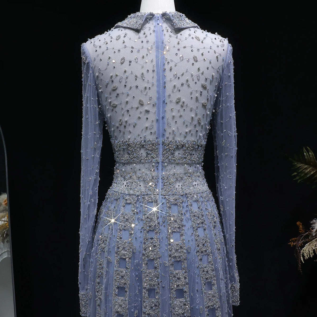 Elegant MC THE BLACK DIAMOND MC long sleeve formal evening dress with intricate detailing and a sleek silhouette.