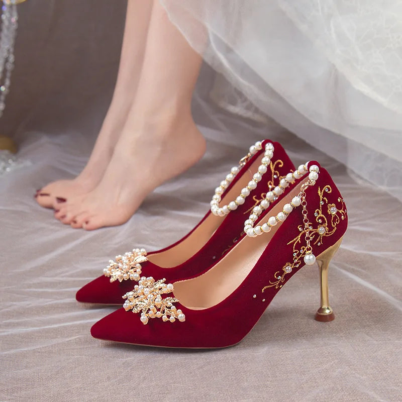 Women’s red high heel shoes by Mohammad Collection with pointed toes, elegant design, and water diamond accents for formal occasions.
