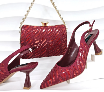 Nigerian style women heels and shiny clutch by MC THE BLACK DIAMOND, featuring pointed toe stiletto shoes and elegant party accessories.