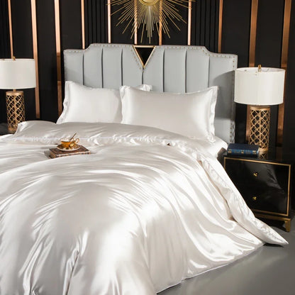 Luxury solid silk bedding set with duvet cover, fitted sheet, flat sheet, and pillowcases from MC The Black Diamonds.
