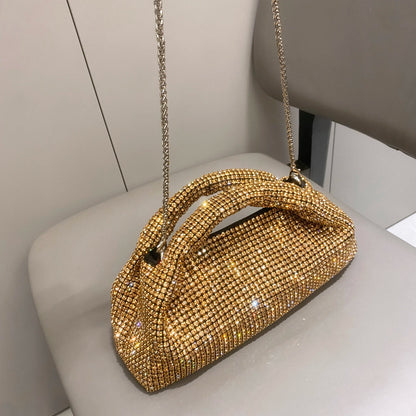 Shiny crystal clutch purse by MC THE BLACK DIAMOND, a luxury handmade evening handbag with rhinestones and a bucket shoulder bag design.