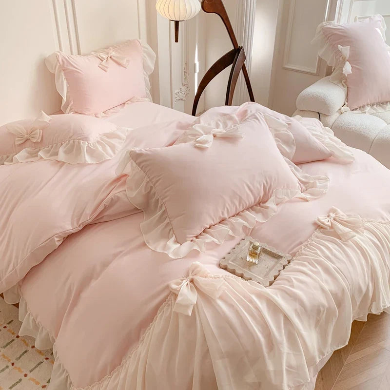 Three-piece white bedding set with ruffled duvet cover by MC The Black Diamonds, featuring elegant bedsheets and decorative ruffles.