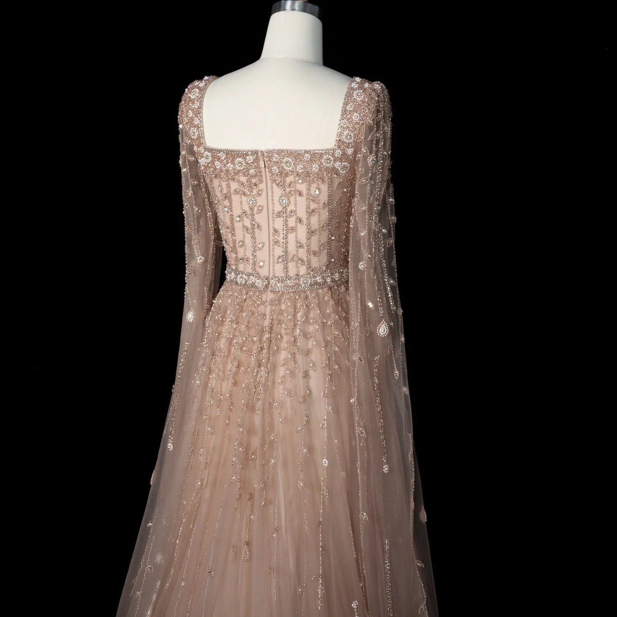 Elegant pink Dubai evening dress by MC THE BLACK DIAMOND, featuring intricate details and a flowing design for formal occasions.