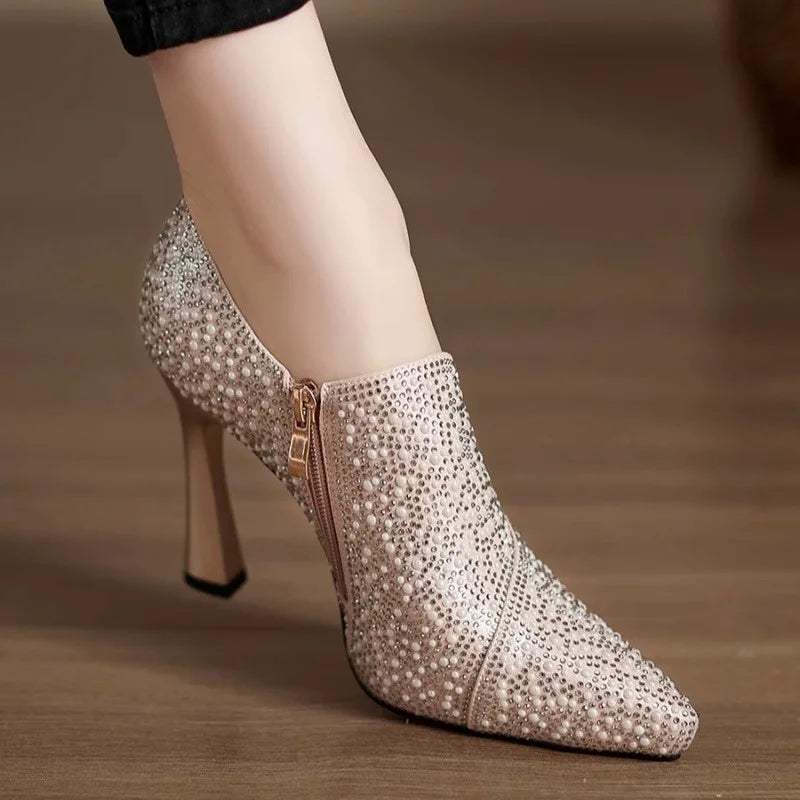 Elegant rhinestone high heels by Mohammad Collection featuring pointed toes, pearls, crystals, and champagne color for bridal occasions.