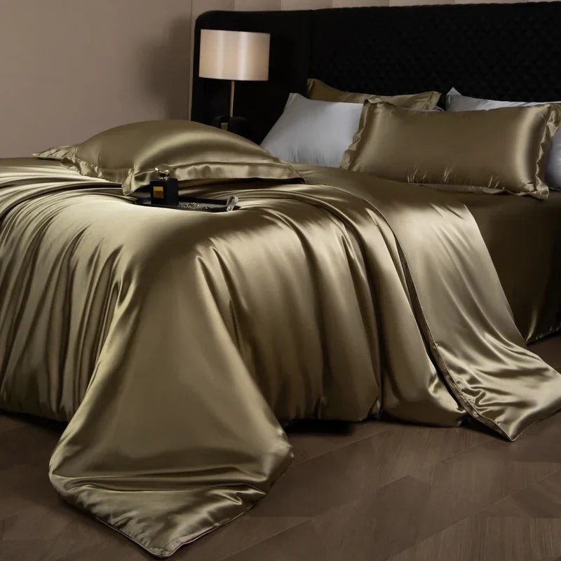 Luxury silk bed sheets set with duvet cover, fitted sheet, flat sheet, and pillowcases in king, queen, full, or twin sizes.