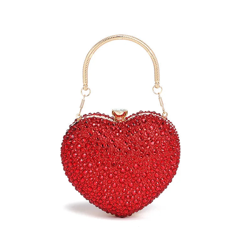 Luxury MC THE BLACK DIAMOND diamond inlay heart-shaped crystal clutch purse with rhinestone embellishments and a shoulder strap.
