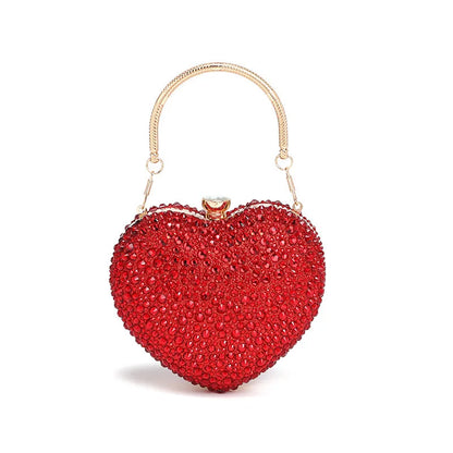 Luxury MC THE BLACK DIAMOND diamond inlay heart-shaped crystal clutch purse with rhinestone embellishments and a shoulder strap.