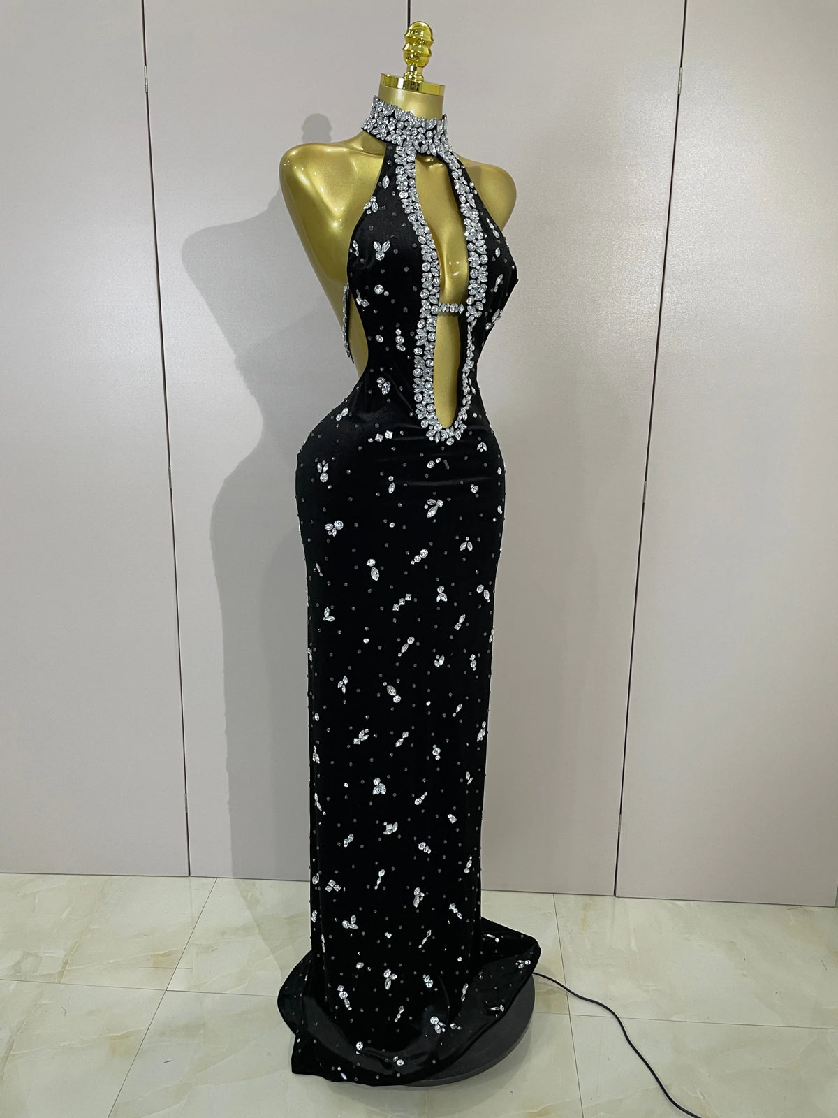 Sparkly velvet dress by MC THE BLACK DIAMOND featuring a sleek, fitted design with shimmering embellishments.