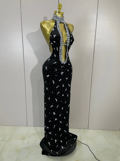 Sparkly velvet dress by MC THE BLACK DIAMOND featuring a sleek, fitted design with shimmering embellishments.