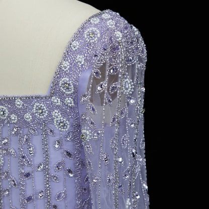 Elegant MC Luxury Pink Dubai evening dress by MC THE BLACK DIAMOND, featuring a flowing design and intricate details.