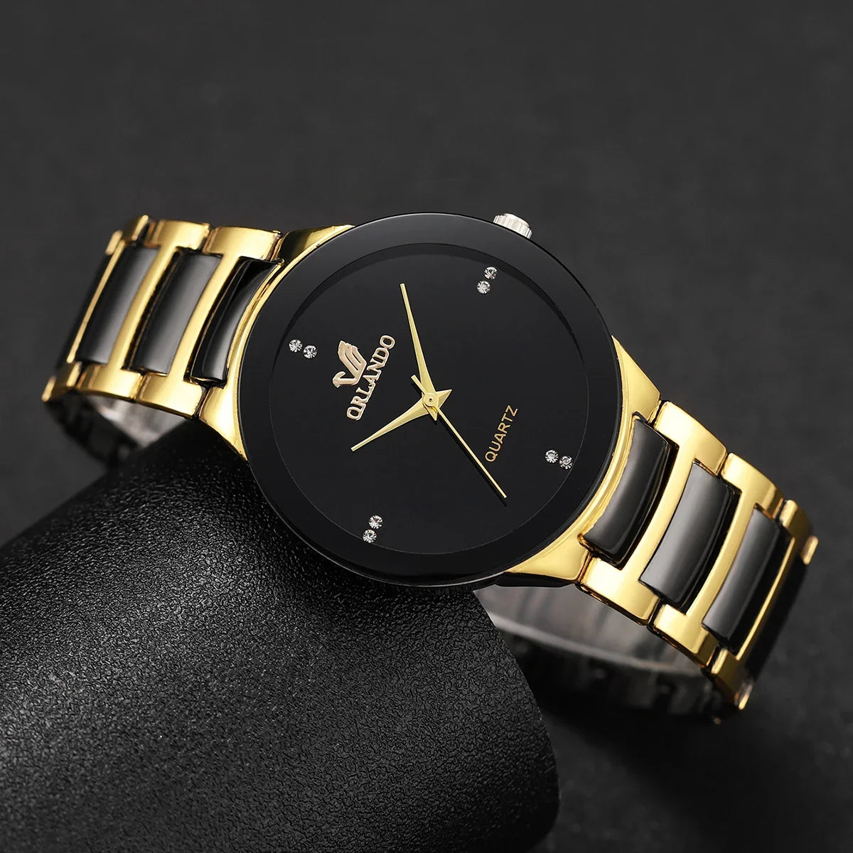 Pair of MC The Black Diamonds his and hers matching watches with black dials and silver bands, showcasing elegant timepieces for couples.