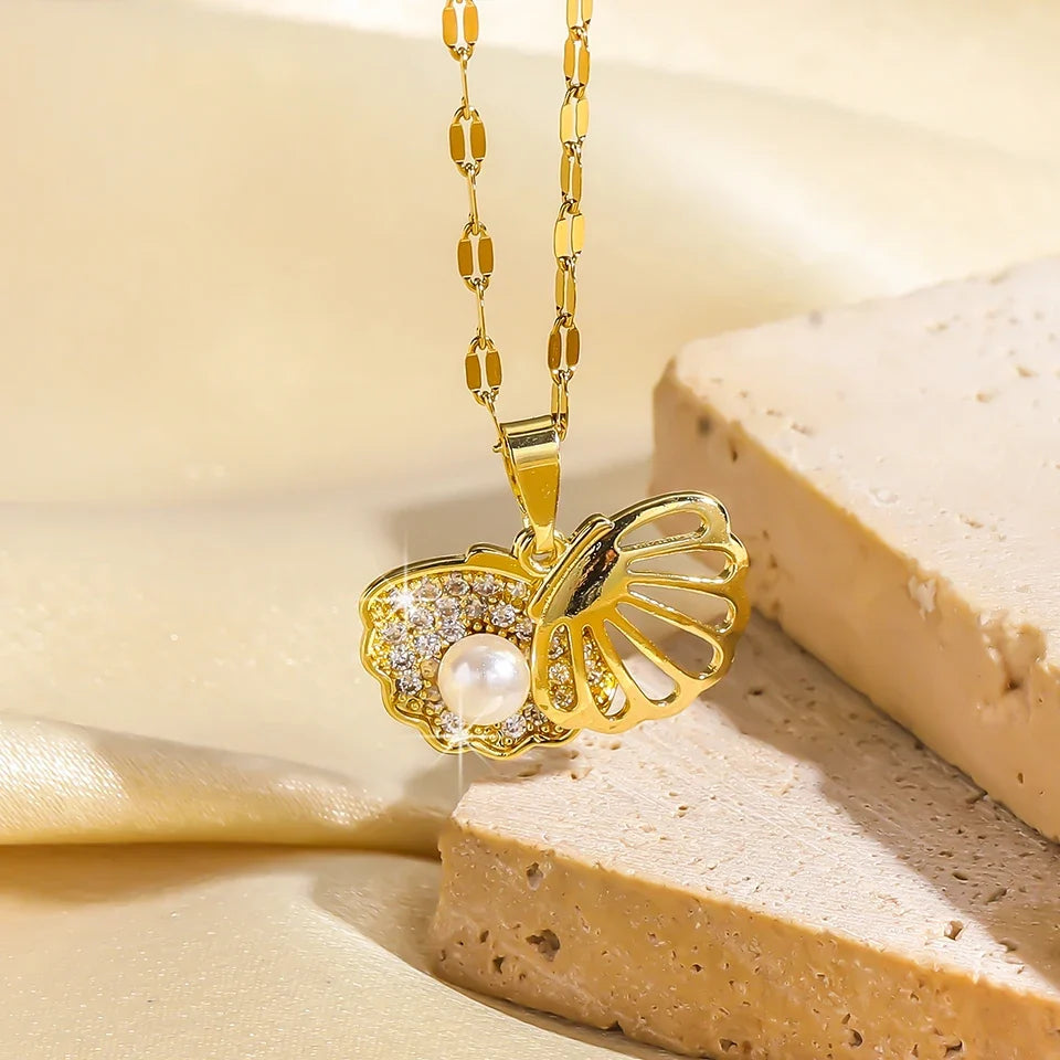 Gold-colored ZAKOL French shell pearl necklace by 𝕄𝕔 𝕋𝕙𝕖 𝔹𝕝𝕒𝕔𝕜 𝔻𝕚𝕒𝕞𝕠�