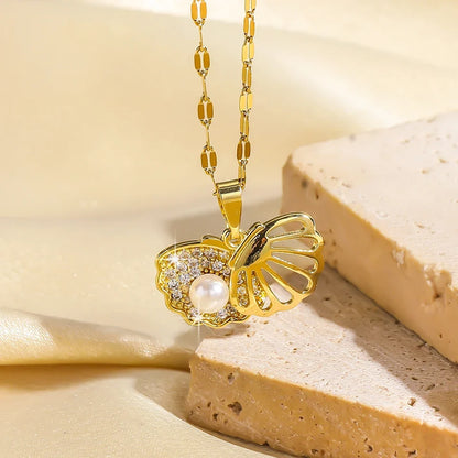 Gold-colored ZAKOL French shell pearl necklace by 𝕄𝕔 𝕋𝕙𝕖 𝔹𝕝𝕒𝕔𝕜 𝔻𝕚𝕒𝕞𝕠�