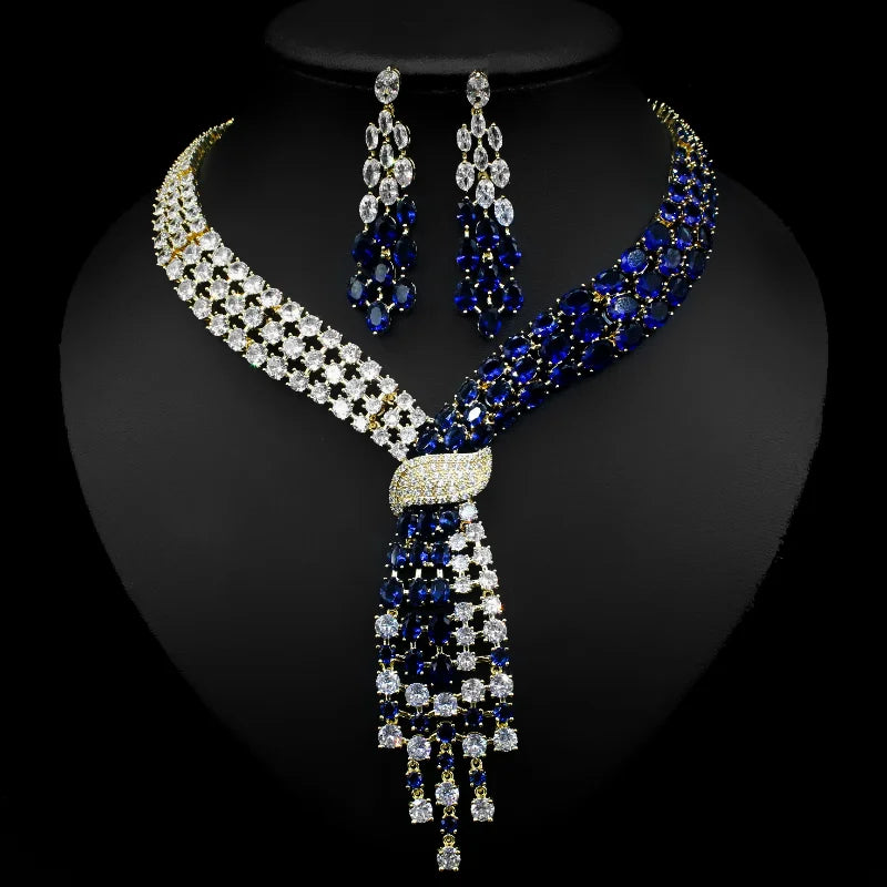 Handmade Lab Emerald and Diamond jewelry set including wedding rings, earrings, and necklace in 14K white gold for women.