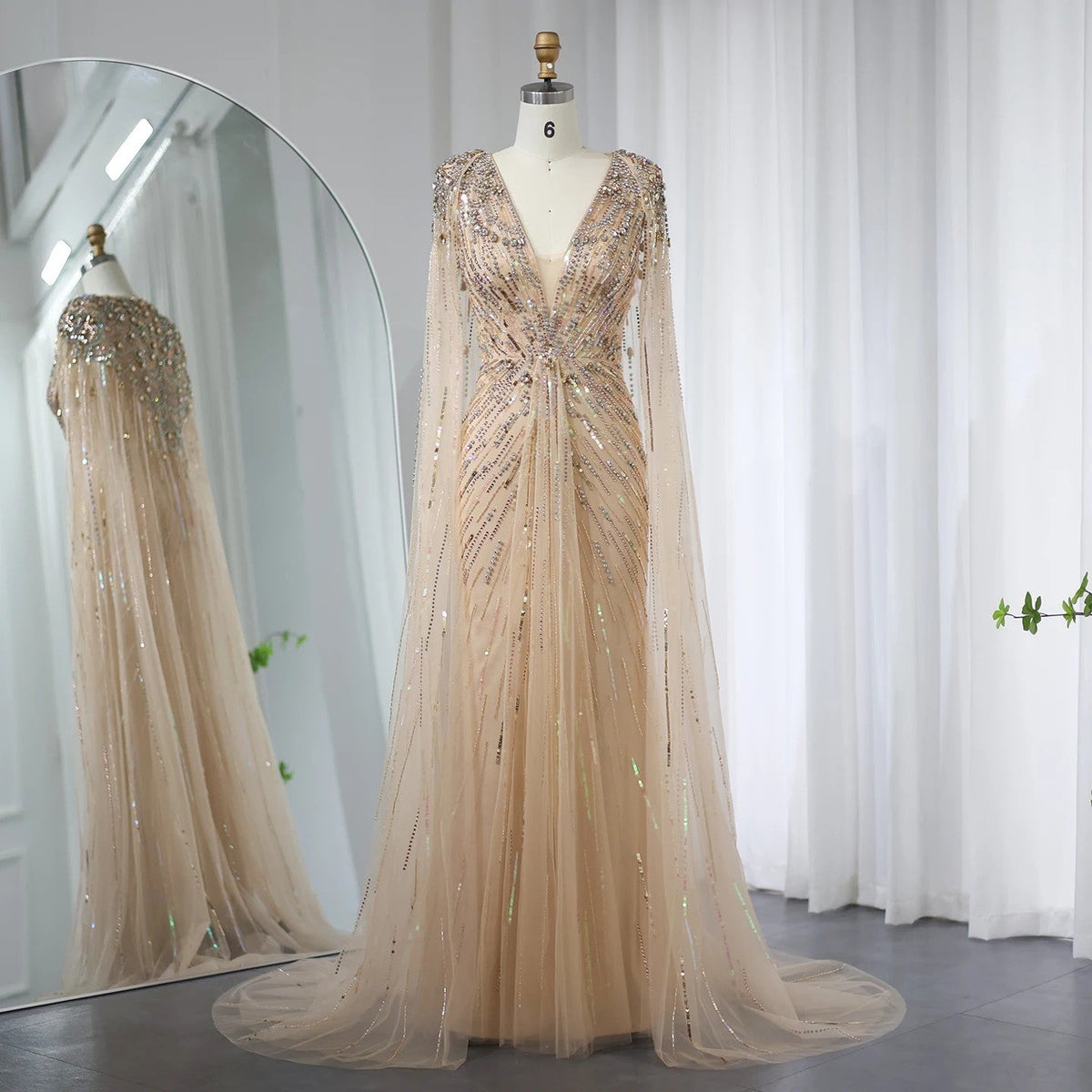 Luxury Dubai Sage Green Women’s Dress by MC THE BLACK DIAMOND, featuring elegant design and flowing fabric.