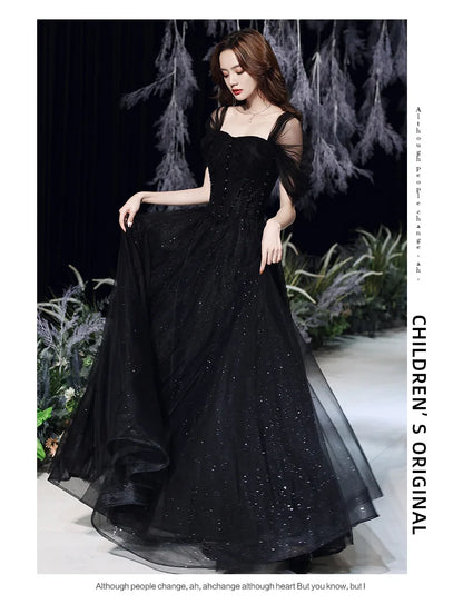 Elegant black evening dress for women by MC THE BLACK DIAMOND, featuring a sleek, stylish design perfect for formal occasions.