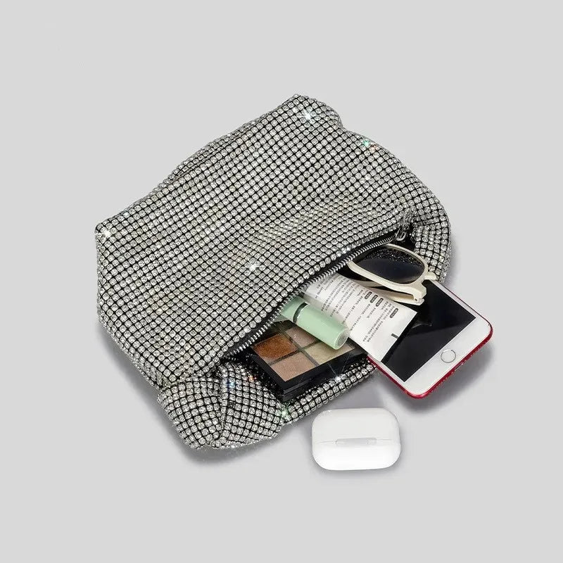 Silver crystal handle evening bag by MC THE BLACK DIAMOND featuring rhinestone knot design and top handle for women.