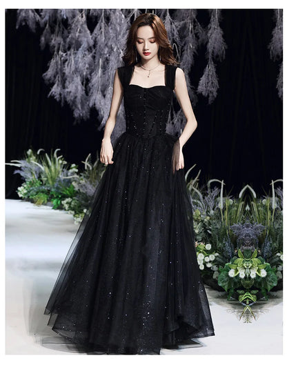 Black evening dress for women by MC THE BLACK DIAMOND, showcasing elegant design and flowing fabric suitable for formal occasions.