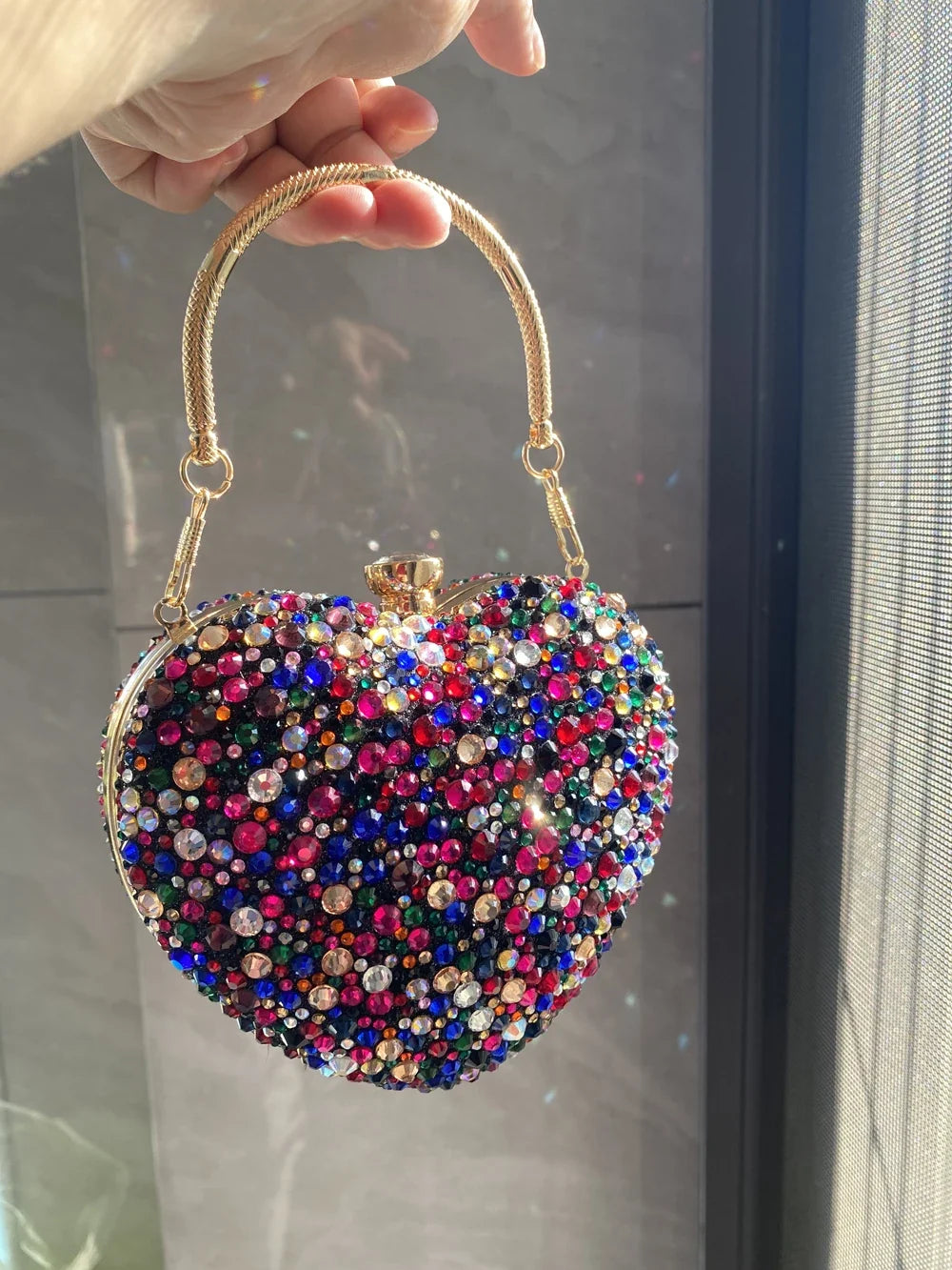 Luxury diamond inlay heart-shaped crystal clutch purse by MC THE BLACK DIAMOND, evening wedding party shoulder bag with rhinestone embellishments.