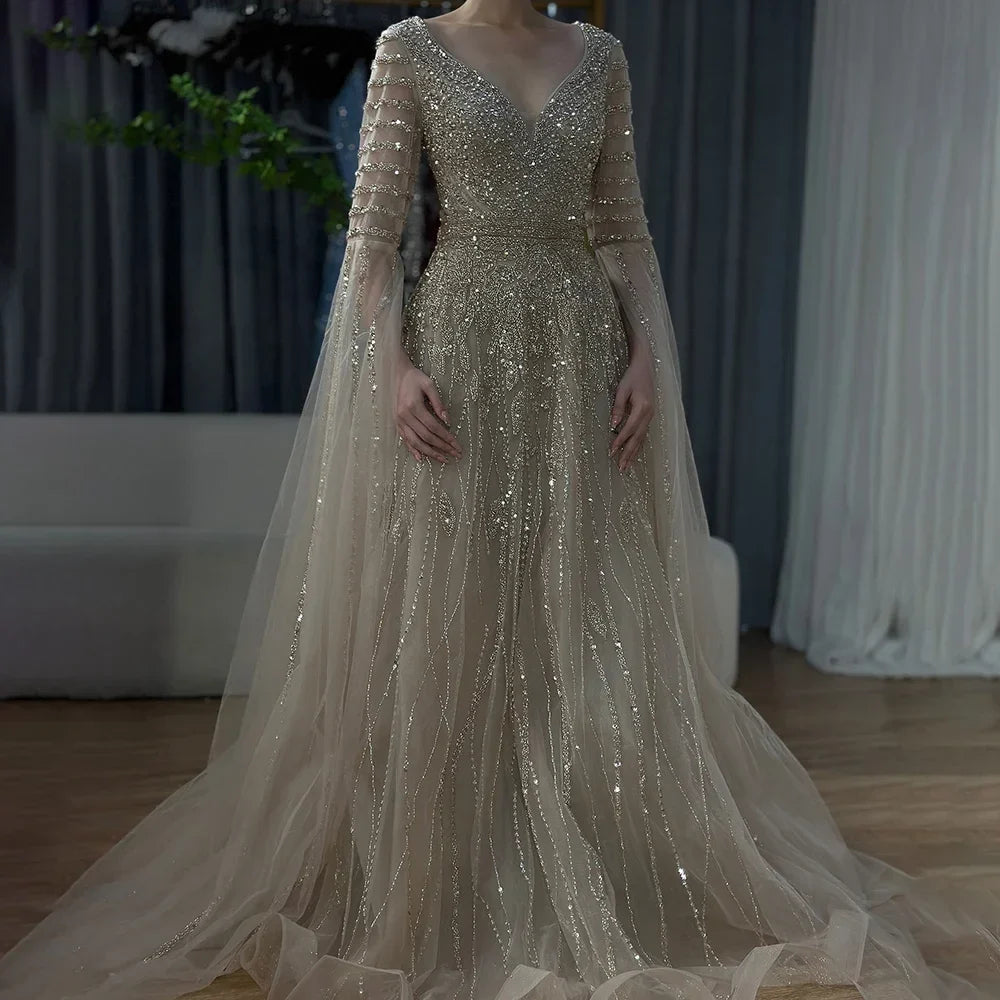 Elegant Arabic caramel-colored dress by MC THE BLACK DIAMOND, featuring intricate details and a flowing silhouette.