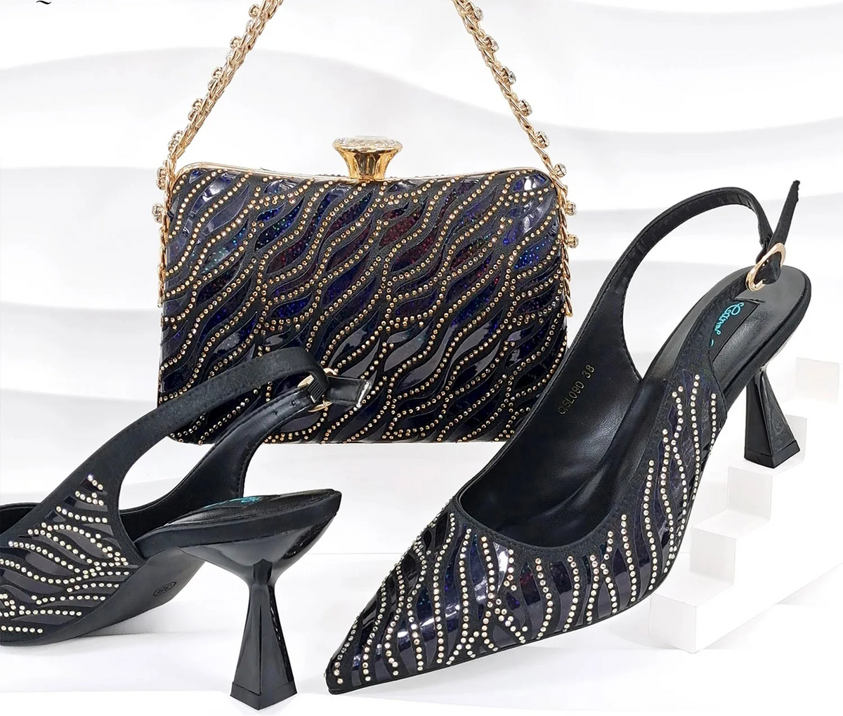 Nigerian style women’s MC THE BLACK DIAMOND heels with pointed toes and shiny clutch bag for party fashion.