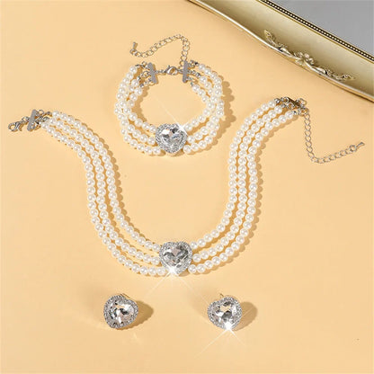 Elegant bridal jewelry set featuring a necklace and versatile earrings by MC THE BLACK DIAMOND, displayed with intricate design details.