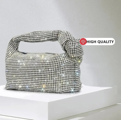 Silver crystal handle evening bag with rhinestone knot detail by MC THE BLACK DIAMOND, luxury designer purse for women.